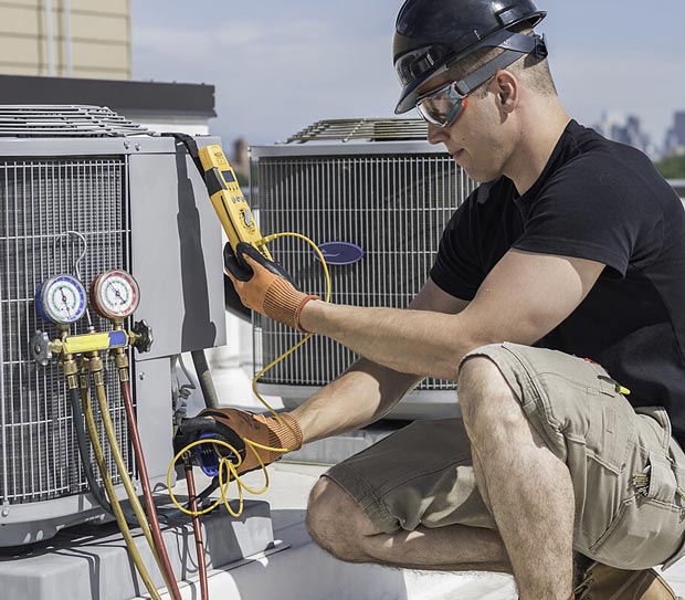 Man testing an HVAC system.