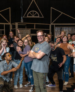 H. Russ Brown surrounded by his Theatre Students.