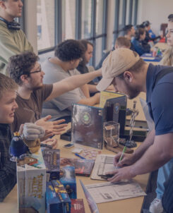 Students at event signing up for clubs.