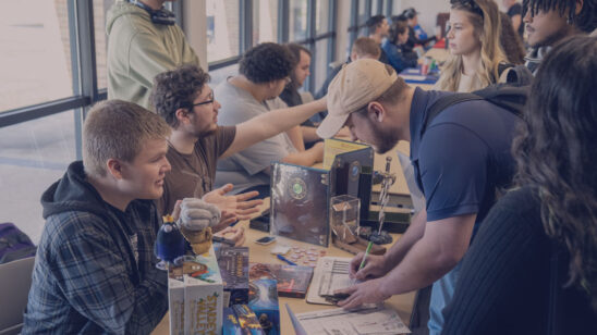 Students at event signing up for clubs.