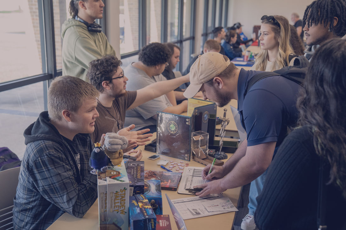 Students at event signing up for clubs.