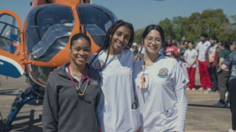 Group of students outside next to a life flight helicopter.