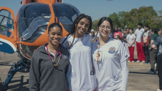 Group of students outside next to a life flight helicopter.