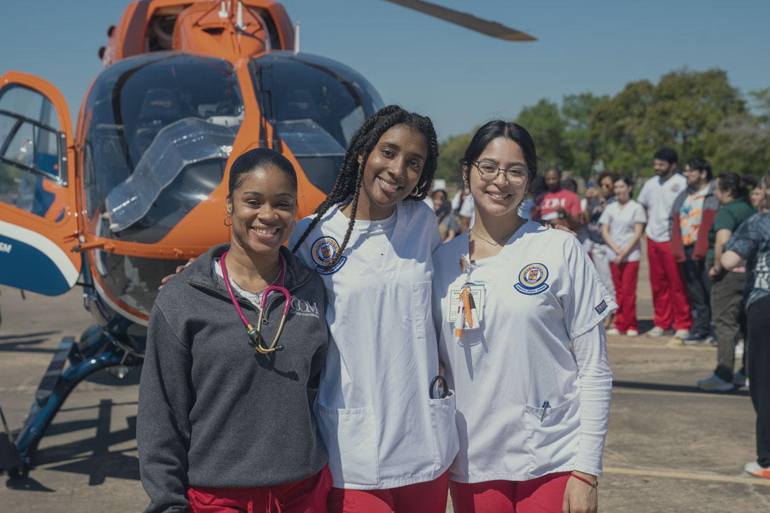 Group of students outside next to a life flight helicopter.